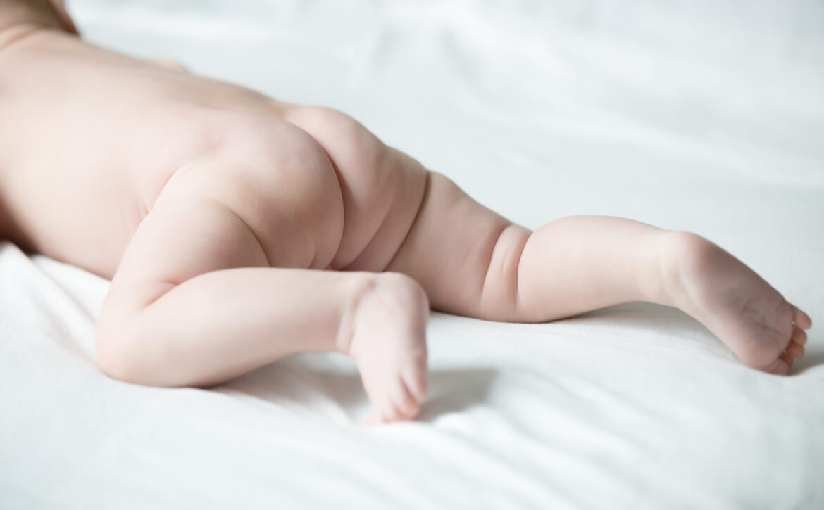 A cute newborn trying to crawl